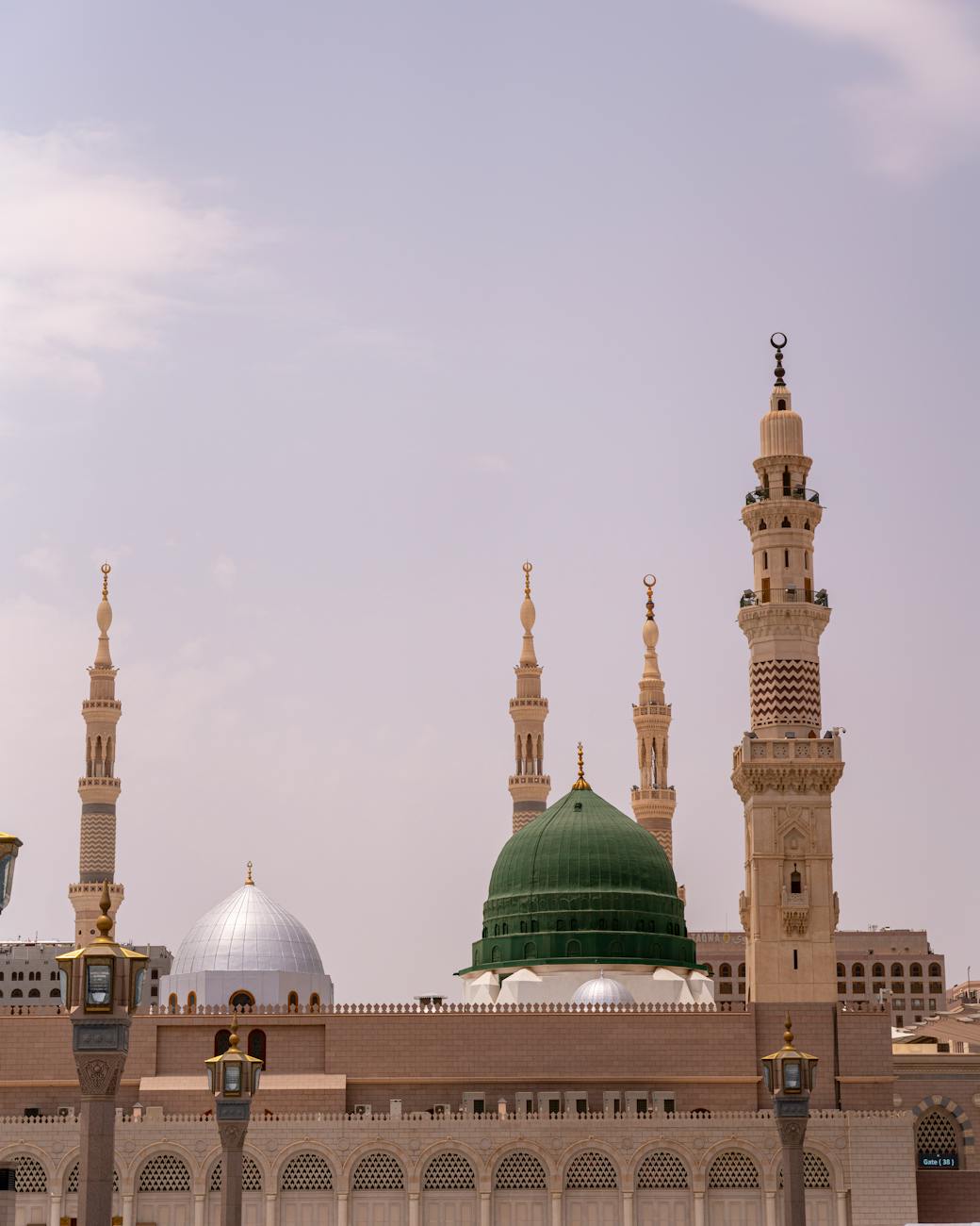 the green dome at the prophets mosque and the bab al baqi minaret