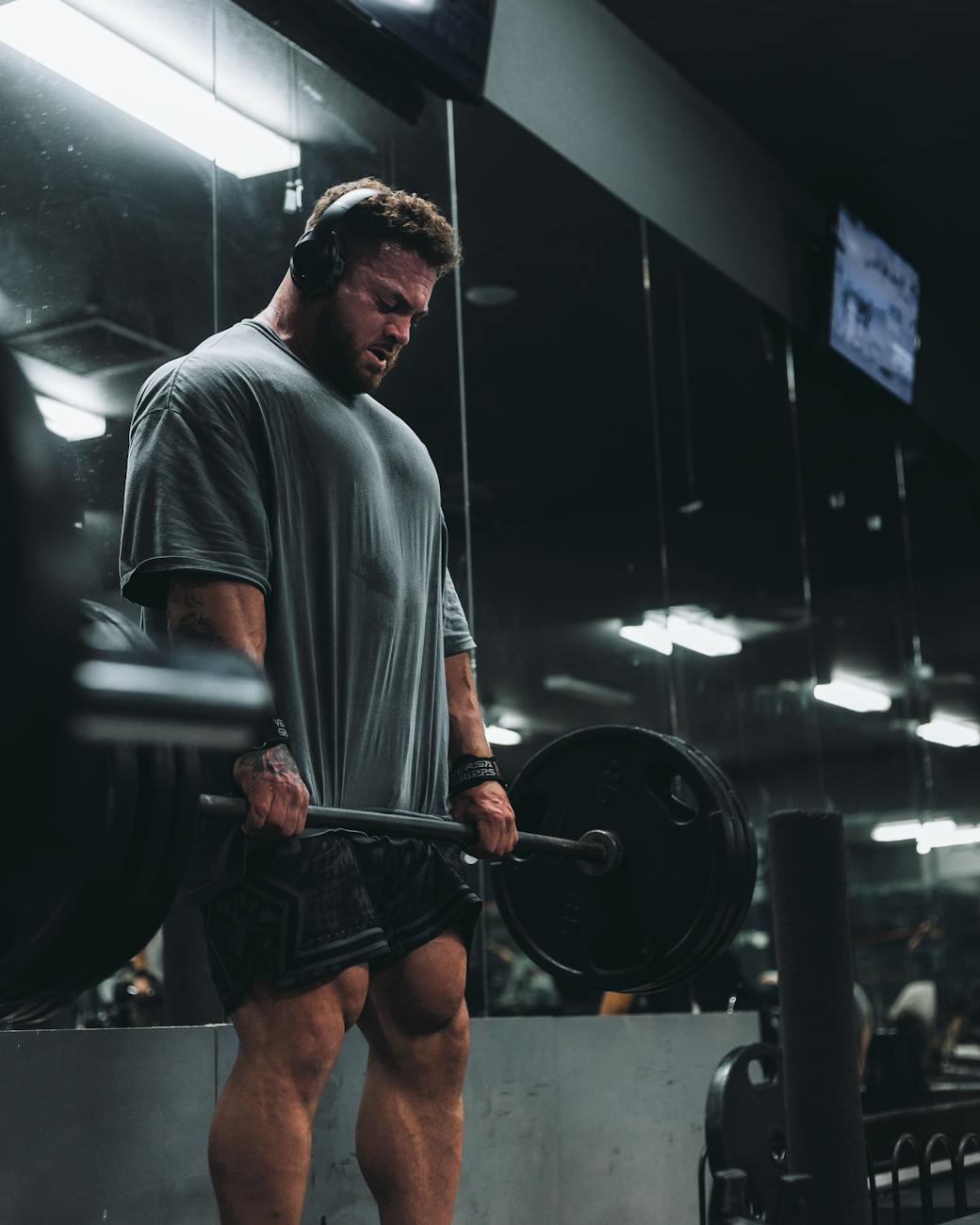 a man with a barbell in his hands